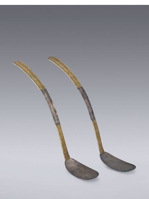 A pair of silver and parcel-gilt spoons
