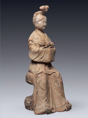 20 Pottery figure of a seated female with a dog