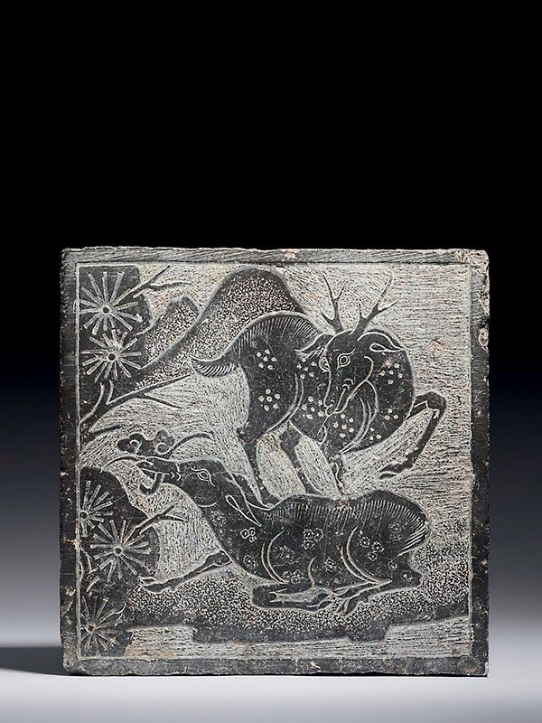 Stone panel carved with two deer