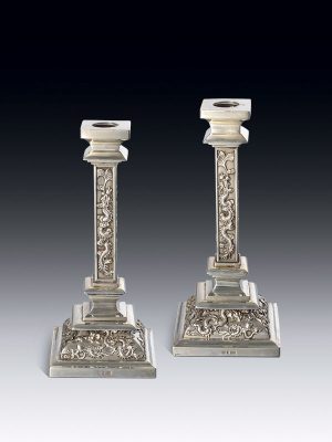 Pair of silver candlesticks by Wang Hing