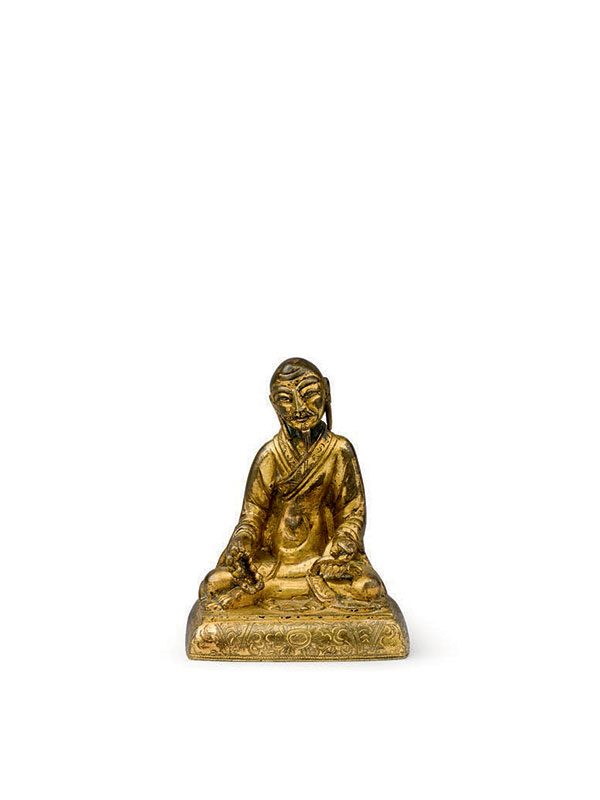 Gilt bronze miniature figure of a seated luohan