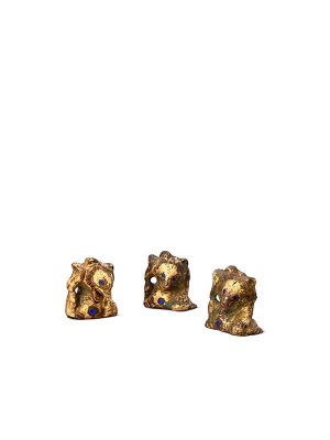 Three gilt bronze and inlaid bear supports