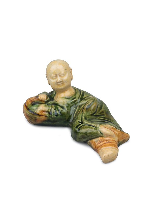 Sancai ceramic brush rest in the form of a recumbent boy