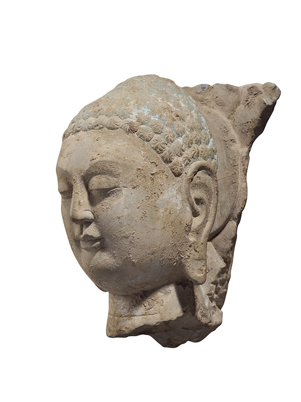 Limestone head of Buddha with fragmentary halo